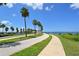 View of winding road, palm trees, and a great place to walk or bike by the ocean at 11 Sunset Dr # 303, Sarasota, FL 34236