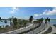 Scenic views of the bridge over the water lined with palm trees at 11 Sunset Dr # 303, Sarasota, FL 34236