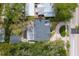 Aerial view of the property showcasing the roof, surrounding landscape, and proximity to the road at 1231 S Orange Ave, Sarasota, FL 34239