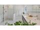 Bright bathroom featuring a glass shower, double sink vanity with chrome faucets, and white subway tile at 1231 S Orange Ave, Sarasota, FL 34239
