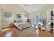 Spacious bedroom with high ceilings and a walk-in closet, and sliding glass door access to the backyard at 1231 S Orange Ave, Sarasota, FL 34239