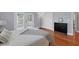 Light-filled bedroom with hardwood floors, closet and accent furniture at 1231 S Orange Ave, Sarasota, FL 34239