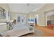 Open bedroom with a high vaulted ceiling, walk-in closet, and sliding glass door access to the backyard at 1231 S Orange Ave, Sarasota, FL 34239