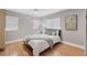 Bright bedroom features a comfortable bed and natural light from the window at 1231 S Orange Ave, Sarasota, FL 34239