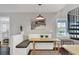 Charming dining nook with a built-in bench and a view of the garden at 1231 S Orange Ave, Sarasota, FL 34239