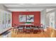 Bright dining room features hardwood floors, an accent wall, and contemporary decor at 1231 S Orange Ave, Sarasota, FL 34239