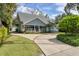 Charming two-story home with a welcoming front porch and beautifully landscaped front yard at 1231 S Orange Ave, Sarasota, FL 34239