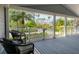 Cozy covered front porch featuring comfortable seating and picturesque neighborhood views at 1231 S Orange Ave, Sarasota, FL 34239