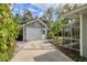 A detached single-car garage on a well manicured lot, close to the main house at 1231 S Orange Ave, Sarasota, FL 34239