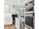 Gourmet kitchen with modern appliances and view into the living room at 1231 S Orange Ave, Sarasota, FL 34239