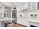 Updated kitchen with white cabinets, stainless appliances, and ample counter space at 1231 S Orange Ave, Sarasota, FL 34239