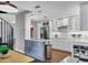 Modern kitchen with stainless steel appliances and white cabinets at 1231 S Orange Ave, Sarasota, FL 34239