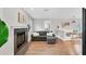 Cozy living room with a fireplace and an adjacent breakfast nook at 1231 S Orange Ave, Sarasota, FL 34239