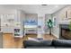 Open-concept living room flows into a modern kitchen and features a decorative fireplace at 1231 S Orange Ave, Sarasota, FL 34239