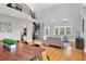Open living room boasts soaring ceilings, a spiral staircase, and ample natural light at 1231 S Orange Ave, Sarasota, FL 34239