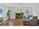 Inviting living room with a decorative fireplace and large windows at 1231 S Orange Ave, Sarasota, FL 34239