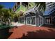 Charming storefronts in a sunny shopping plaza, showcasing a variety of retail shops and palm trees at 1231 S Orange Ave, Sarasota, FL 34239