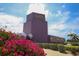 Exterior shot of the Van Wezel Performing Arts Hall with vibrant pink flowers in the foreground at 1231 S Orange Ave, Sarasota, FL 34239