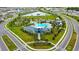 Aerial view of a community center, pool, and playground surrounded by green spaces and residential homes at 12534 Nantahala Run Run, Parrish, FL 34219