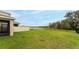 Expansive backyard featuring a scenic pond view and privacy fencing, seamlessly blending nature and comfort at 12534 Nantahala Run Run, Parrish, FL 34219
