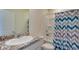Bathroom featuring granite countertop vanity, toilet, shower, and tub combo with curtain at 12534 Nantahala Run Run, Parrish, FL 34219