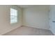 Bedroom features a neutral color palette, carpet, and a window for natural light at 12534 Nantahala Run Run, Parrish, FL 34219