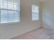 Comfortable bedroom with carpeted floor and windows with blinds at 12534 Nantahala Run Run, Parrish, FL 34219