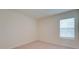 This bedroom features neutral walls and carpet, complemented by a window with blinds at 12534 Nantahala Run Run, Parrish, FL 34219