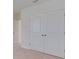 A closet with standard white doors and brass hardware offers storage space at 12534 Nantahala Run Run, Parrish, FL 34219