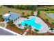 Tranquil community pool offers palm trees, covered pavilion, and a refreshing space for residents in lush surroundings at 12534 Nantahala Run Run, Parrish, FL 34219