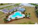 Resort-style pool area with lush landscaping, cozy cabana, ample parking, and a refreshing oasis for community residents at 12534 Nantahala Run Run, Parrish, FL 34219