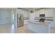 Bright kitchen with stainless steel appliances, granite countertops and large island with sink at 12534 Nantahala Run Run, Parrish, FL 34219
