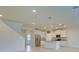 Bright kitchen flows into an open-concept living space with a granite island and stainless appliances at 12534 Nantahala Run Run, Parrish, FL 34219