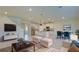 Bright and airy living room with an open floor plan to the kitchen and dining area at 12534 Nantahala Run Run, Parrish, FL 34219