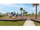 Community playground featuring a variety of play structures in a grassy area at 12534 Nantahala Run Run, Parrish, FL 34219