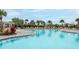 Large community pool with lounge chairs in a resort-style setting at 12534 Nantahala Run Run, Parrish, FL 34219
