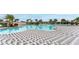 Large community pool with lounge chairs and a patterned pool deck in a resort-style setting at 12534 Nantahala Run Run, Parrish, FL 34219