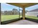 Enclosed screened porch with views of a large backyard, perfect for relaxation and entertainment at 12534 Nantahala Run Run, Parrish, FL 34219
