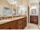 The bathroom features dual sinks, granite counters, and ample counter space for all your needs at 1304 Casey Key Rd, Nokomis, FL 34275