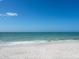 Beach with white sand and calm turquoise water on a sunny day at 1304 Casey Key Rd, Nokomis, FL 34275
