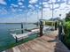 Boat lift on a private dock, offering convenient waterfront access and stunning views at 1304 Casey Key Rd, Nokomis, FL 34275