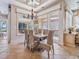 Dining area with water views featuring tile floors and decorative lighting fixtures at 1304 Casey Key Rd, Nokomis, FL 34275