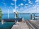 Private boat dock and lift provide direct access to the water, enhancing the coastal lifestyle at 1304 Casey Key Rd, Nokomis, FL 34275
