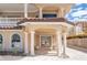 Grand front entry featuring stately columns, tiled roofing, and a welcoming double-door entrance at 1304 Casey Key Rd, Nokomis, FL 34275