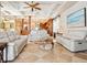 Expansive living room boasts coffered ceilings, tile floors, and seamless access to the gourmet kitchen at 1304 Casey Key Rd, Nokomis, FL 34275
