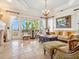 Bright living room featuring large windows with ocean views, classic furnishings, and stylish decor at 1304 Casey Key Rd, Nokomis, FL 34275