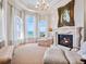Cozy living room includes a fireplace, large windows, and comfortable seating with ocean views at 1304 Casey Key Rd, Nokomis, FL 34275