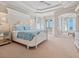 Spacious main bedroom boasts a large bed, private balcony, and stunning ocean views at 1304 Casey Key Rd, Nokomis, FL 34275