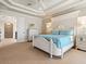 Bright main bedroom featuring a plush bed, dresser, and open doorway at 1304 Casey Key Rd, Nokomis, FL 34275
