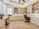 Bright home office with custom built-ins provides ample storage and workspace at 1304 Casey Key Rd, Nokomis, FL 34275